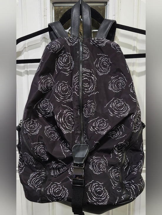 Fabletics The Row Backpack in black with a white digital roses pattern.  main image 5